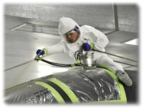 Professional Technician Applying Paint to Aircraft Surface